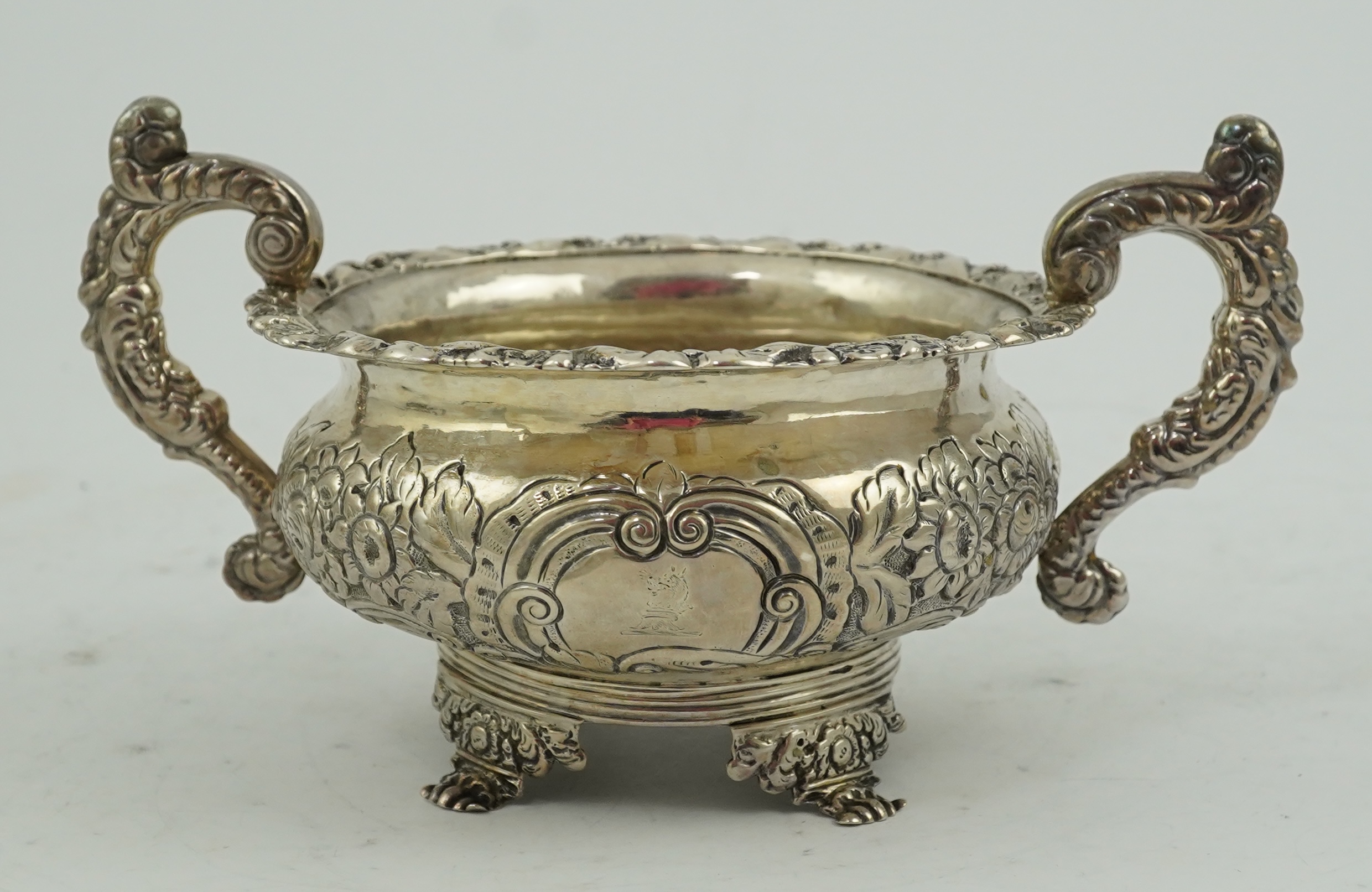 A George IV Irish embossed silver two handled sugar bowl, by James Scott